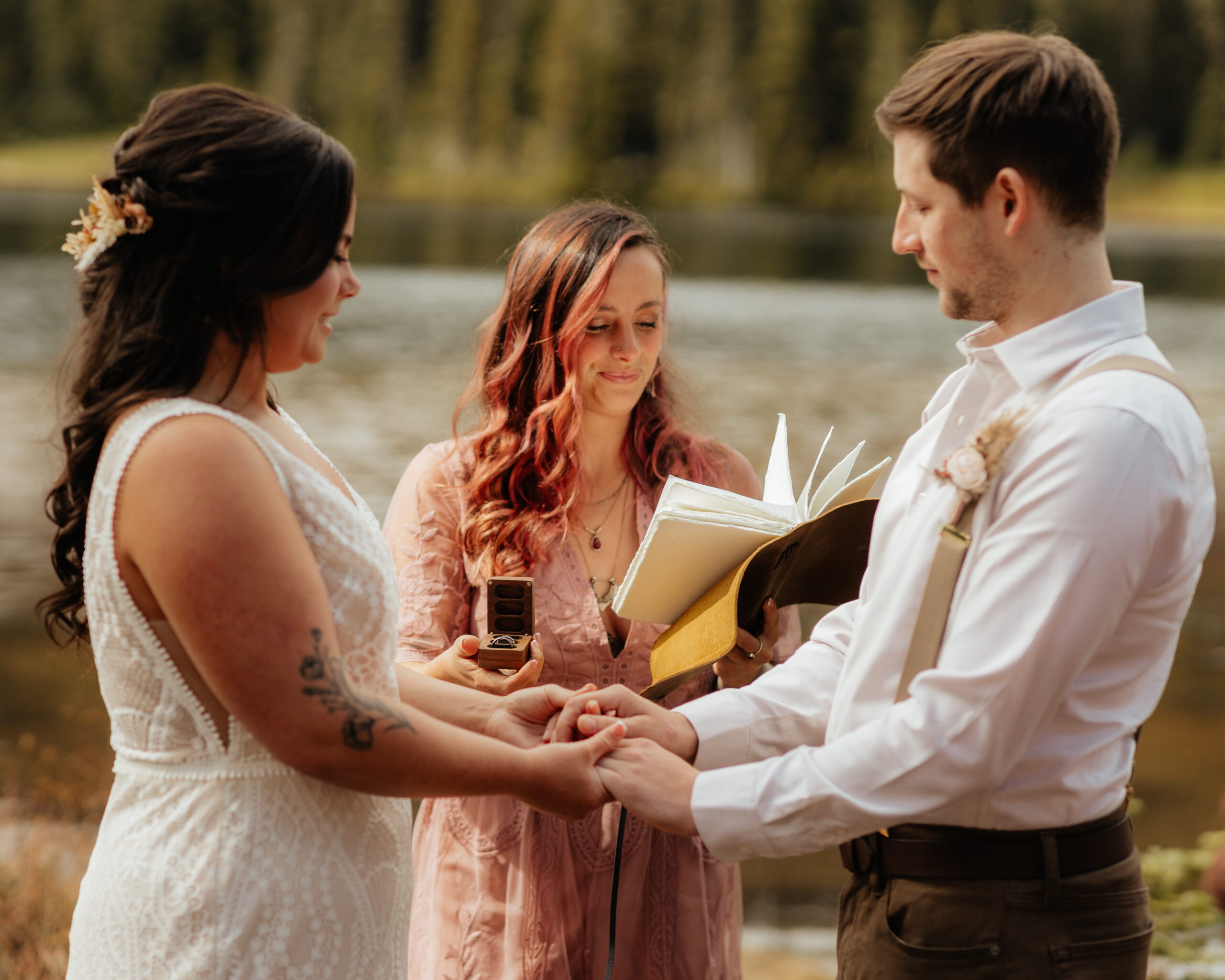 Officiant reads script during Mt Rainier elopement ceremony.