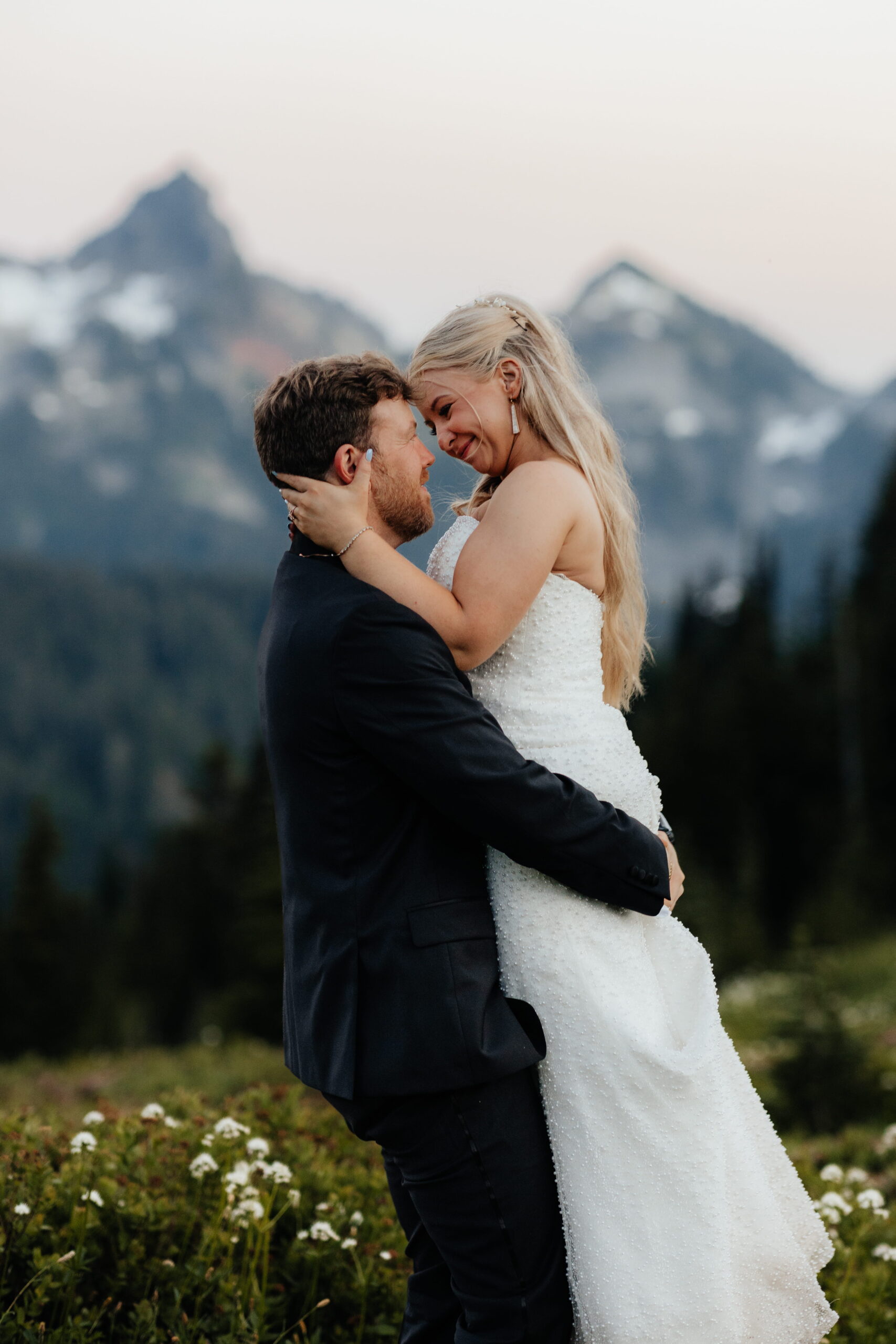 Couple dances on a mountain trail during their Paradise Mt Rainier elopement.