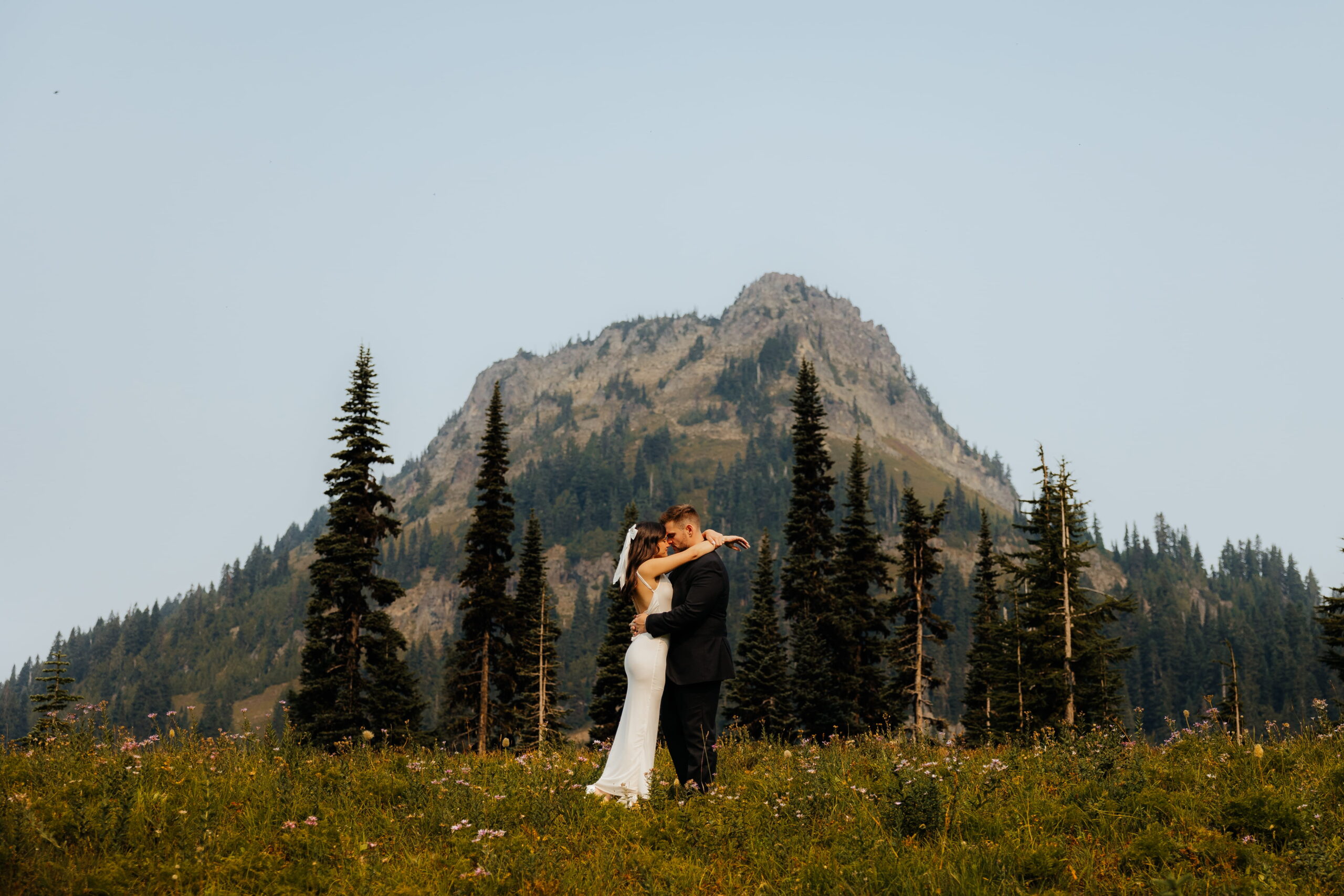 Bride and groom hug during their Sunrise Mt Rainier elopement.