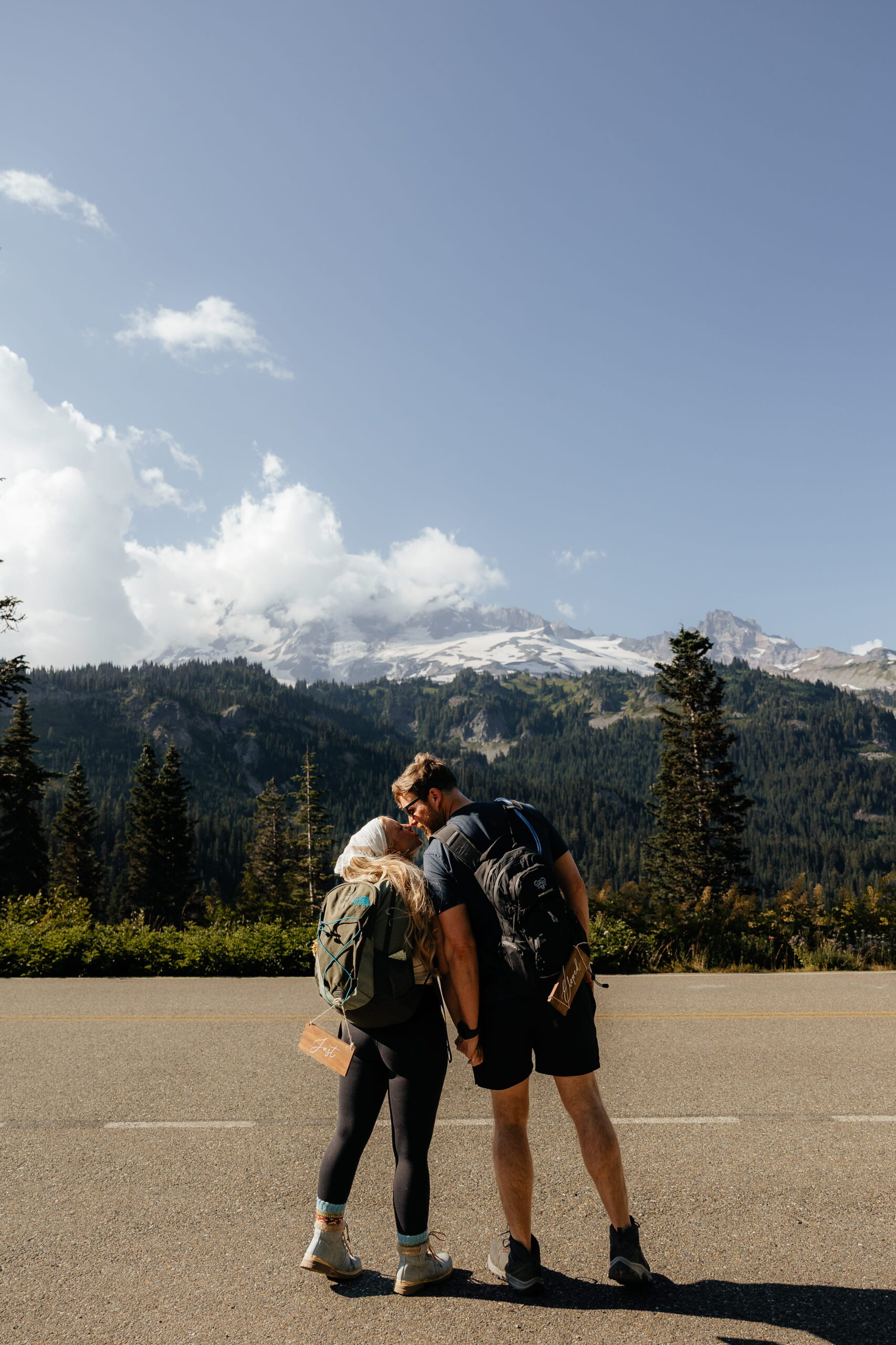 Couple kisses before hiking Mt Rainier during their elopement wedding day.